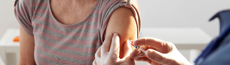 Older woman receiving annual flu vaccination. Older woman receiving annual flu vaccination.