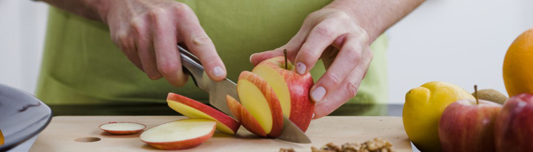 Man cutting fruit Man cutting fruit