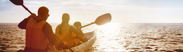 A photo of a family kayaking in the sunrise to illustrate mental health. A photo of a family kayaking in the sunrise to illustrate mental health.