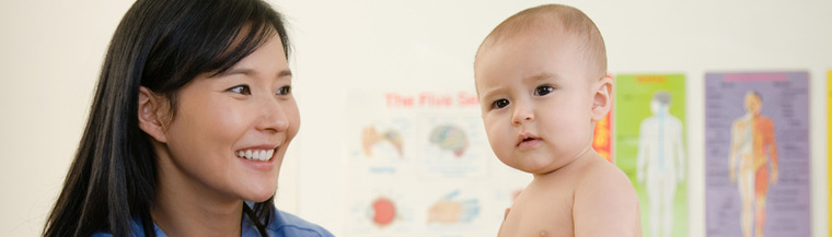 Baby with doctor getting a checkup Baby with doctor getting a checkup