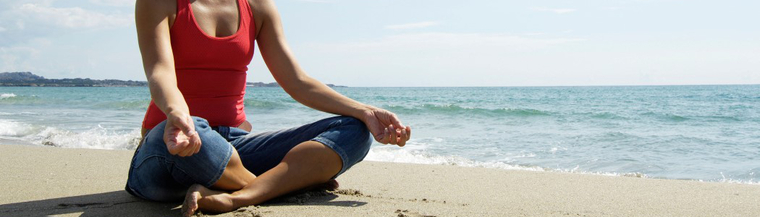 Woman on beach doing yoga for relaxation. Woman on beach doing yoga for relaxation.